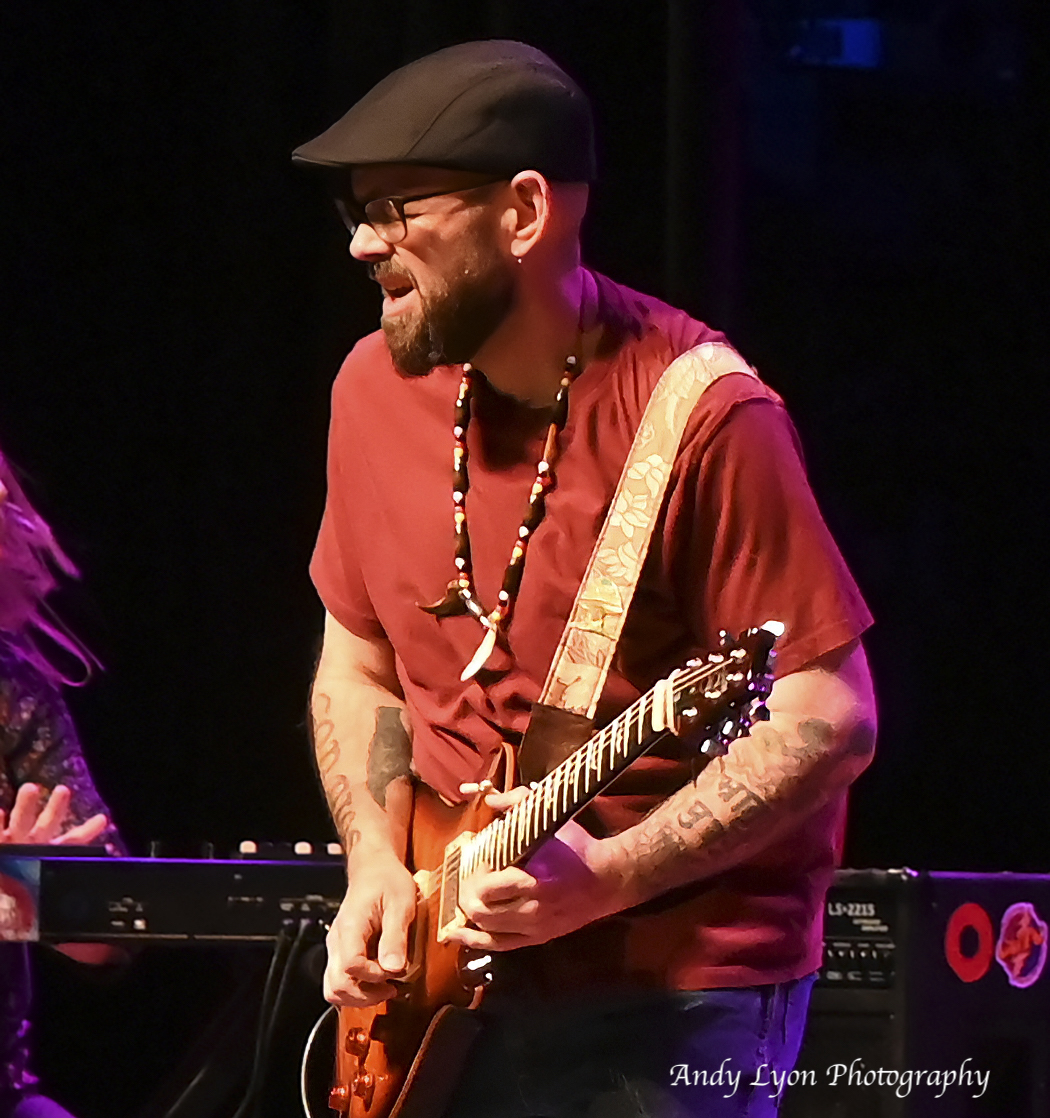 Photo of James Biehn playing guitar for Southbound
